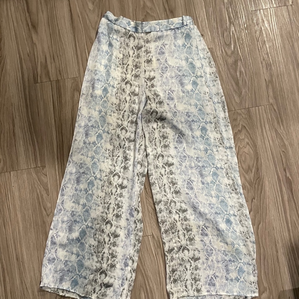 Blue and white snake skin flare pants.